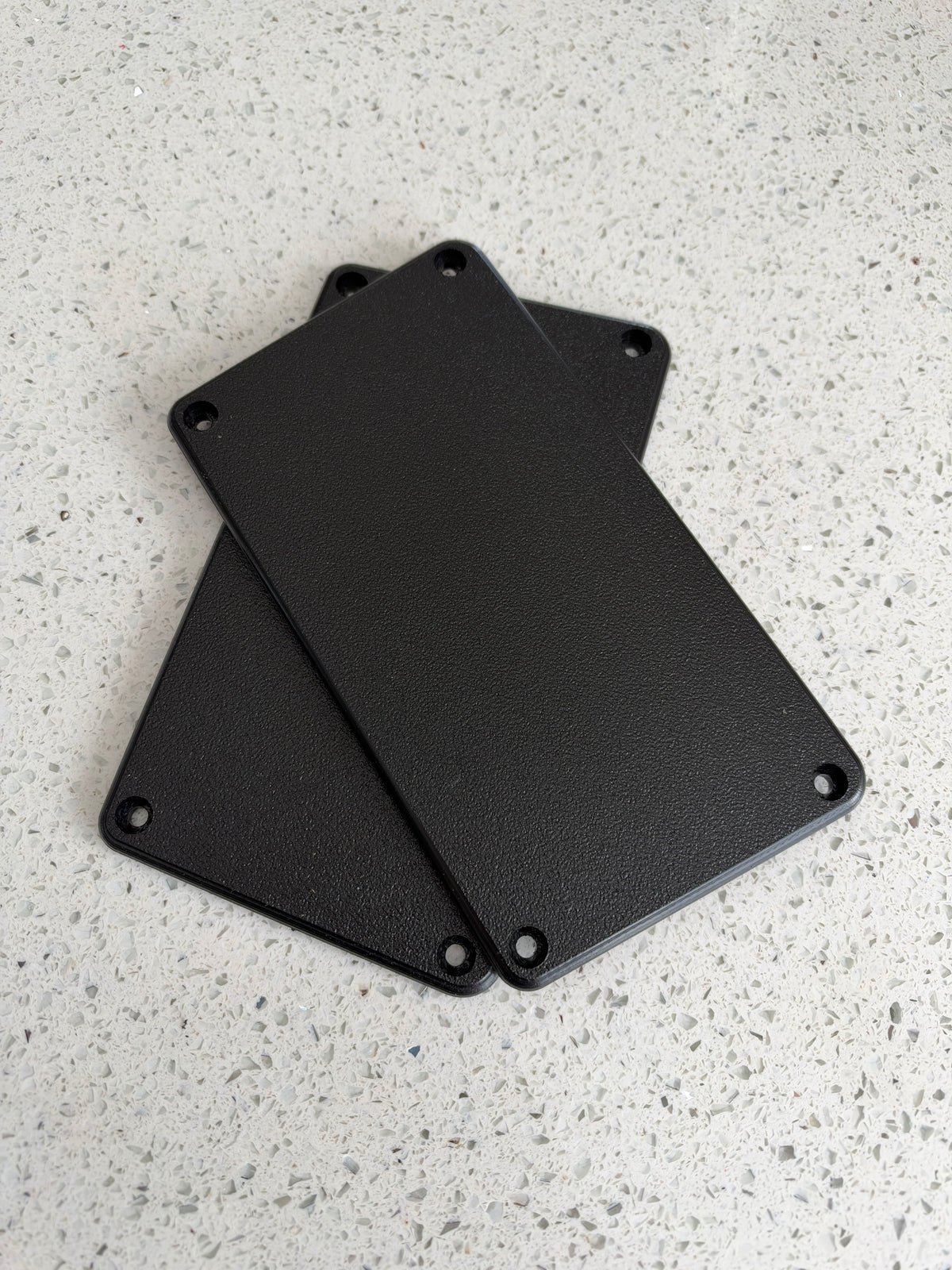 Hobie Pro Angler 14 Rod Tube Delete Plates pair - two black rectangular plates with rounded corners and four mounting holes each